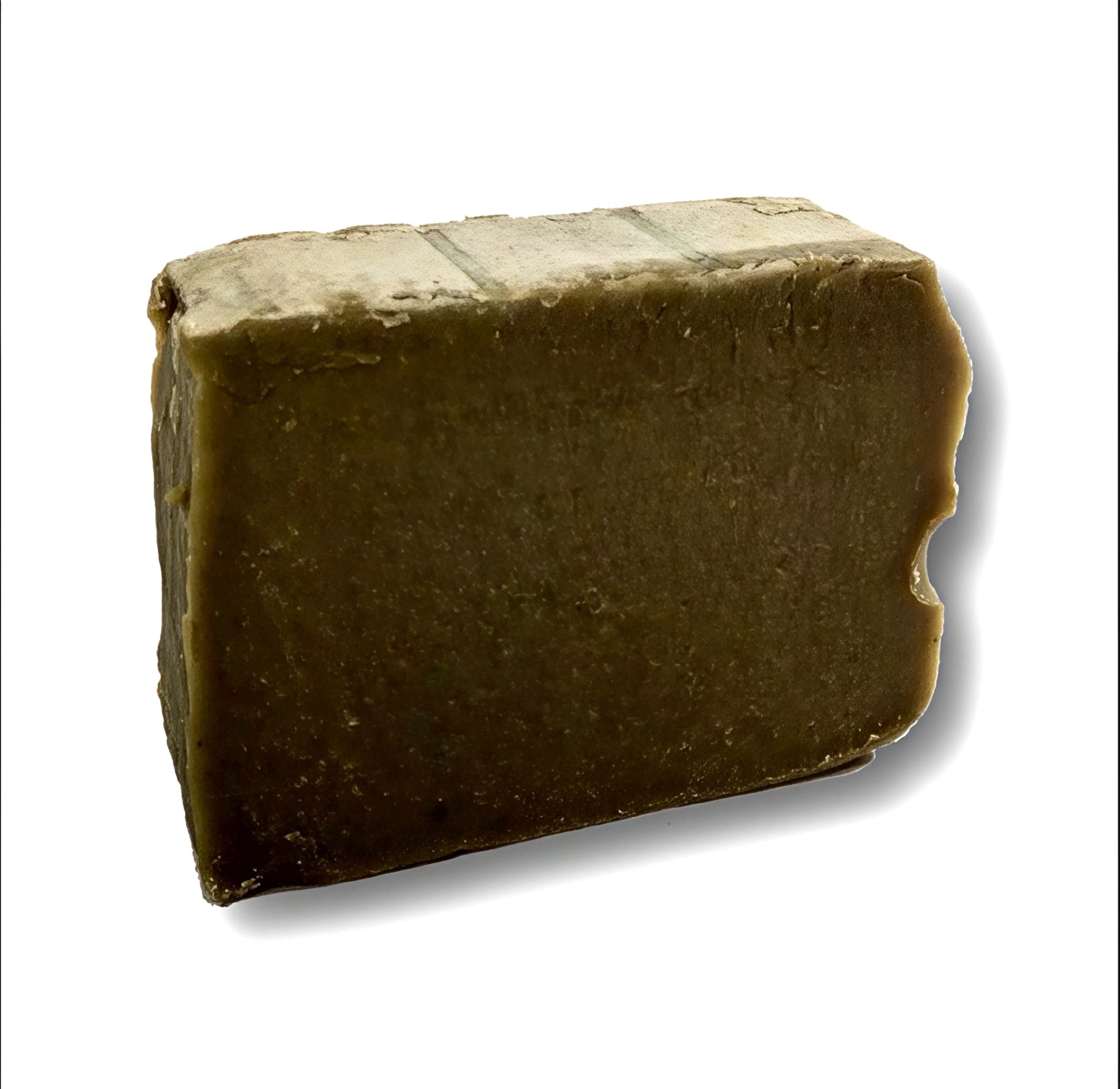 Bar green of dark soap on a white background