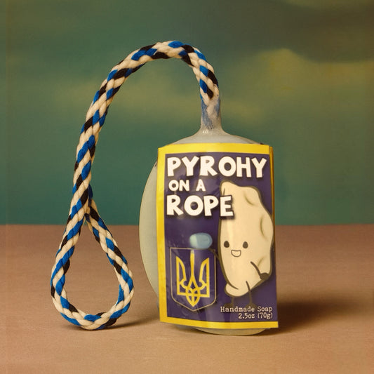 Soap on a rope with a 'Pyrohy on a Rope' label against a green background Ukraine gift