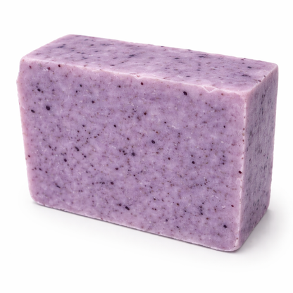 Purple soap bar with speckled texture on a white background