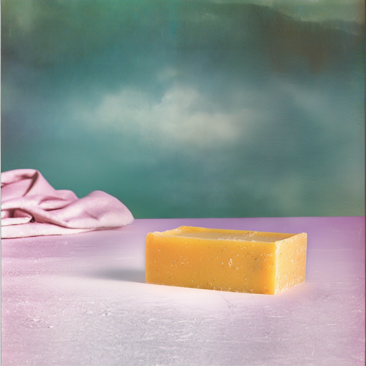 Bar of soap on a textured surface with a blurred background