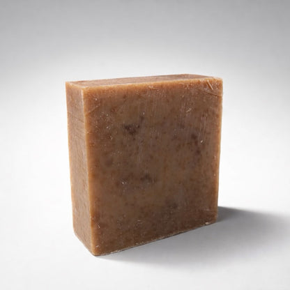 Brown bar of soap on a white background