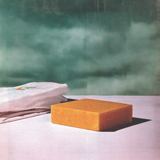 a single bar of orange sasafras soap sits on the table